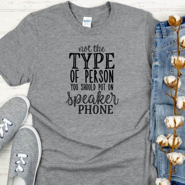 Heather grey t-shirt that says, "Not the kind of person that should be put on speaker phone."